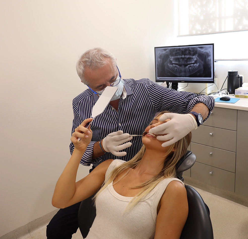 Orthodontist examining a patient's teeth